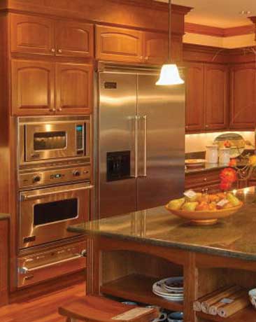 Kitchen with a stainless steel refrigerator and wall ovens