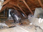 A very poorly installed duct system leaking air in the attic. 